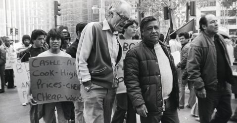 People walking in a protest march in a historic black and white photo