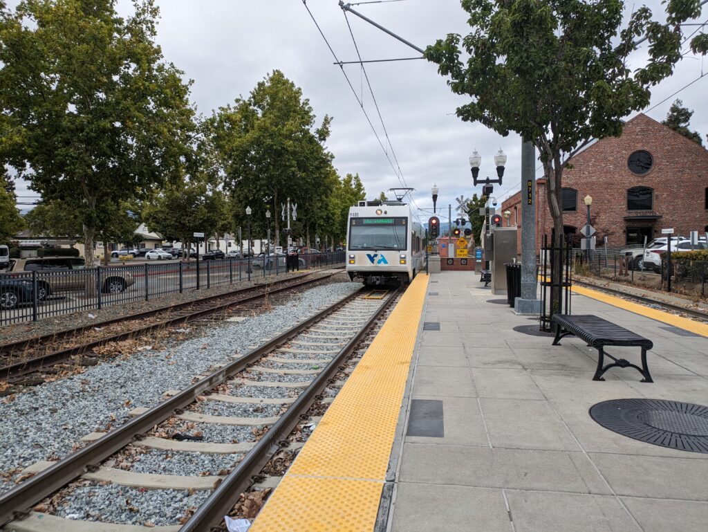 A light rail train approaches the station