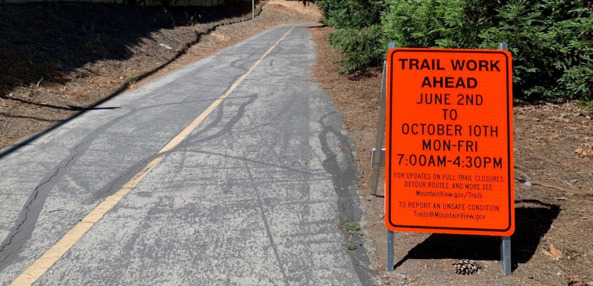 A work sign next to a walking trail in Mountain View, California