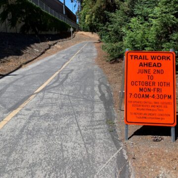 A work sign next to a walking trail in Mountain View, California