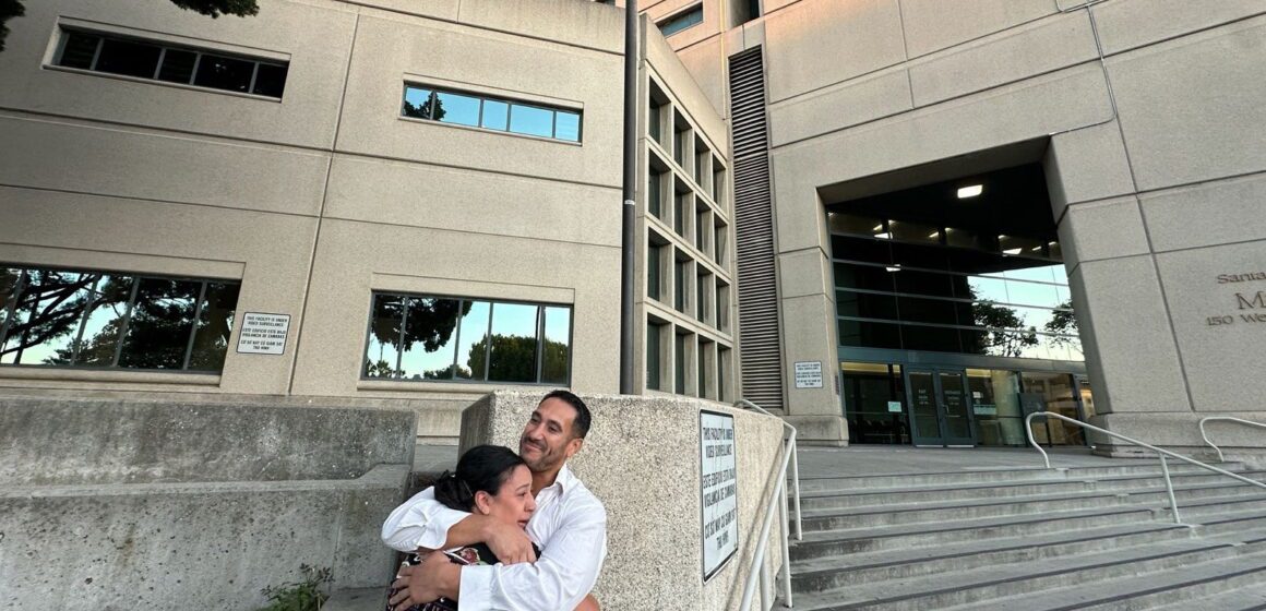 A man and woman hug outside the main jail in San Jose, California