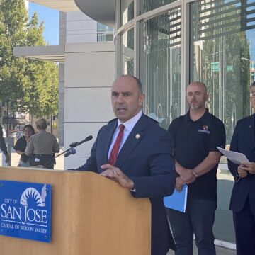 U.S. Congressman Jimmy Panetta speaks at a podium in San Jose, California