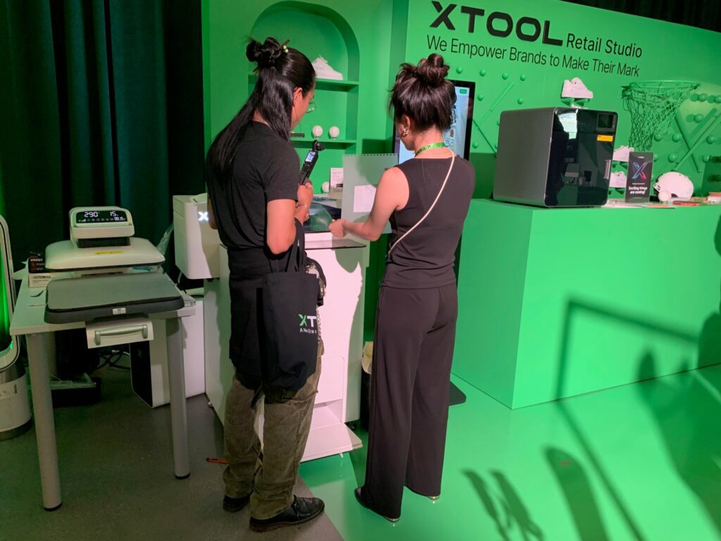 Two people look at printers in a showroom