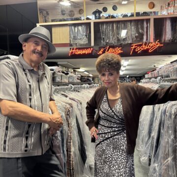 Hammer and Lewis A man and woman standing in a clothing store