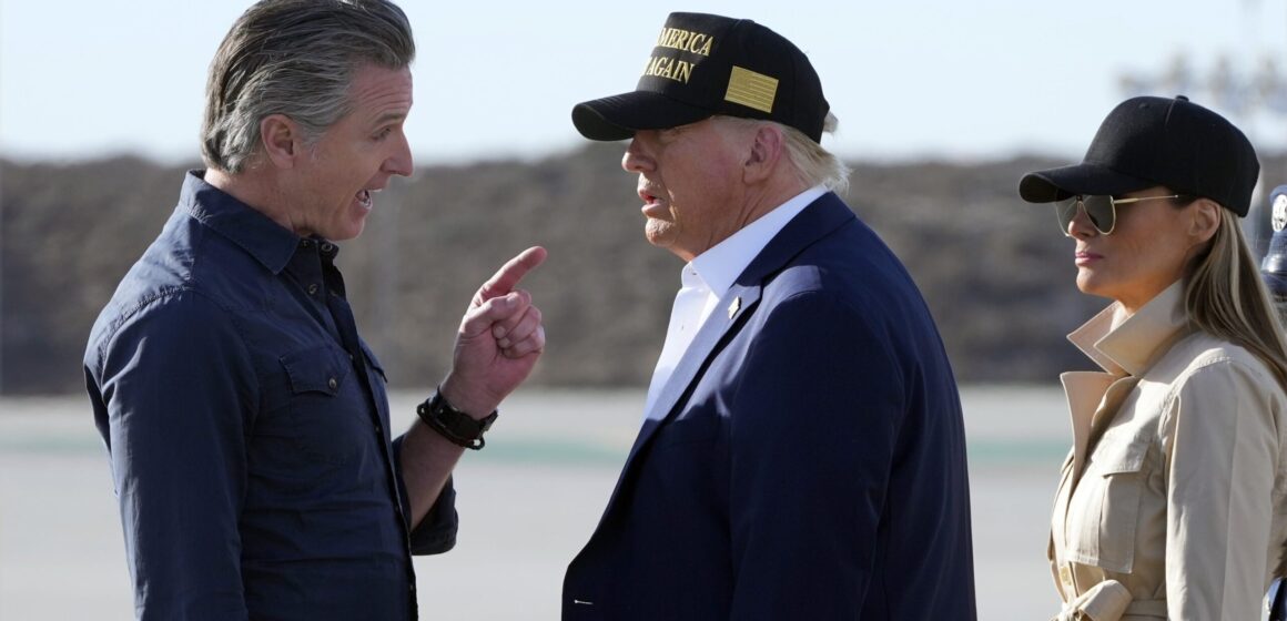 California Governor Gavin Newsom speaks with President Donald Trump and First Lady Melania Trump at Los Angeles International Airport