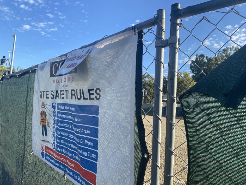 A chain link fence around a development site