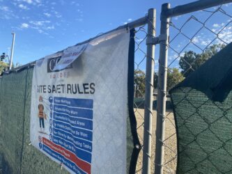 A chain link fence around a development site