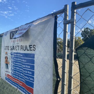 A chain link fence around a development site