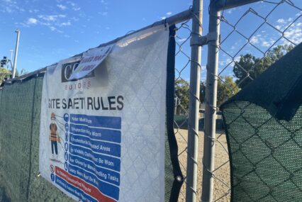 A chain link fence around a development site