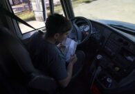 A student driver prepares for a driving session at a truck driving academy in California
