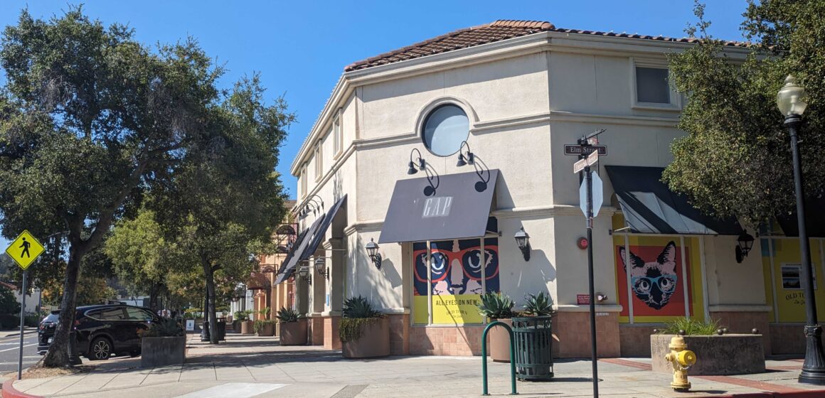 The outside of a one-story commercial building with an awning