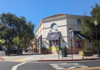 The outside of a one-story commercial building with an awning