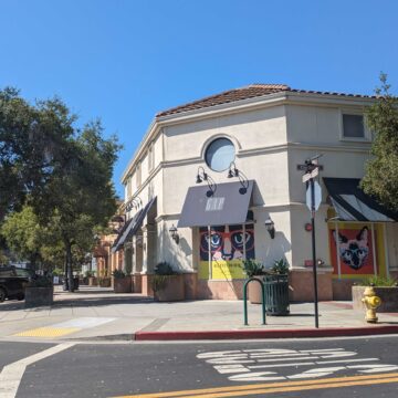 The outside of a one-story commercial building with an awning