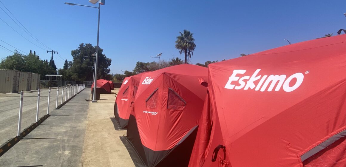 A row of tents for homeless residents in a designated sleeping site in San Jose, California