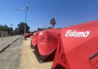 A row of tents for homeless residents in a designated sleeping site in San Jose, California