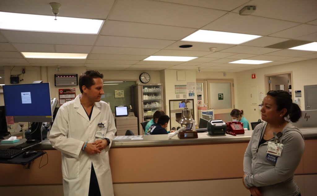 Two health care workers standing inside a hospital in San Jose, California