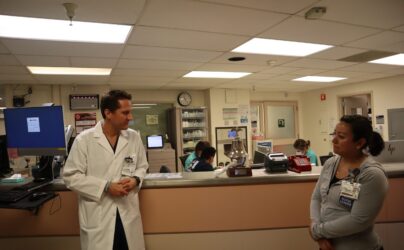 Two health care workers standing inside a hospital in San Jose, California