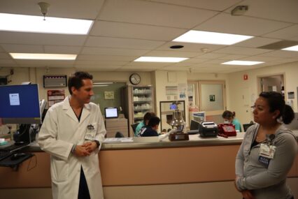 Two health care workers standing inside a hospital in San Jose, California