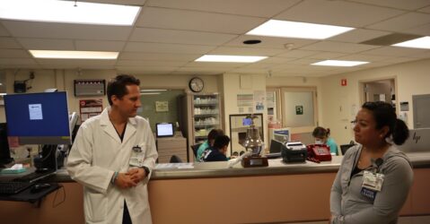 Two health care workers standing inside a hospital in San Jose, California