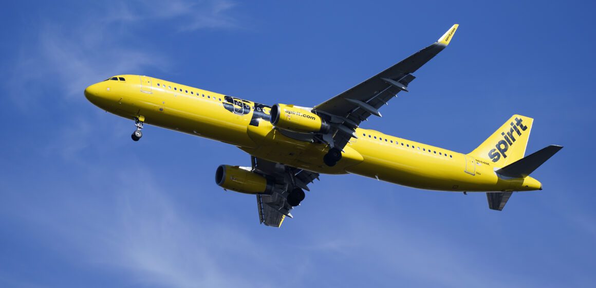 A yellow airplane in the sky