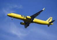 A yellow airplane in the sky