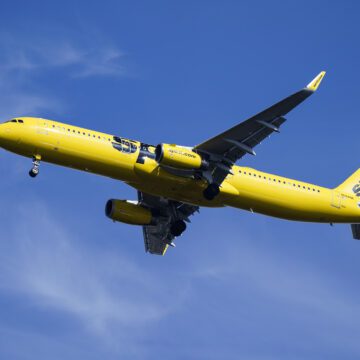 A yellow airplane in the sky