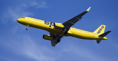 A yellow airplane in the sky