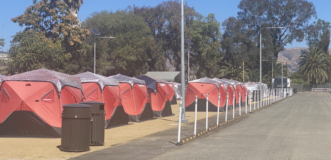 A row of tents at a sanctioned homeless encampment in San Jose, California