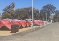 A row of tents at a sanctioned homeless encampment in San Jose, California