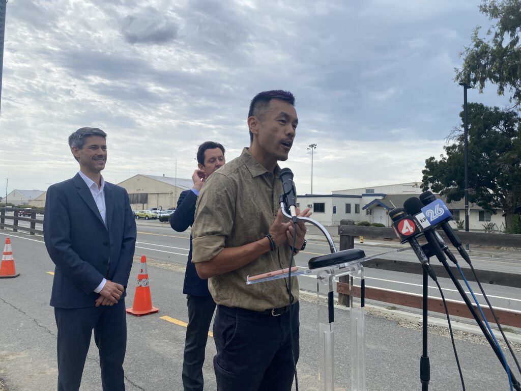 A man speaks at a podium outside in San Jose, California