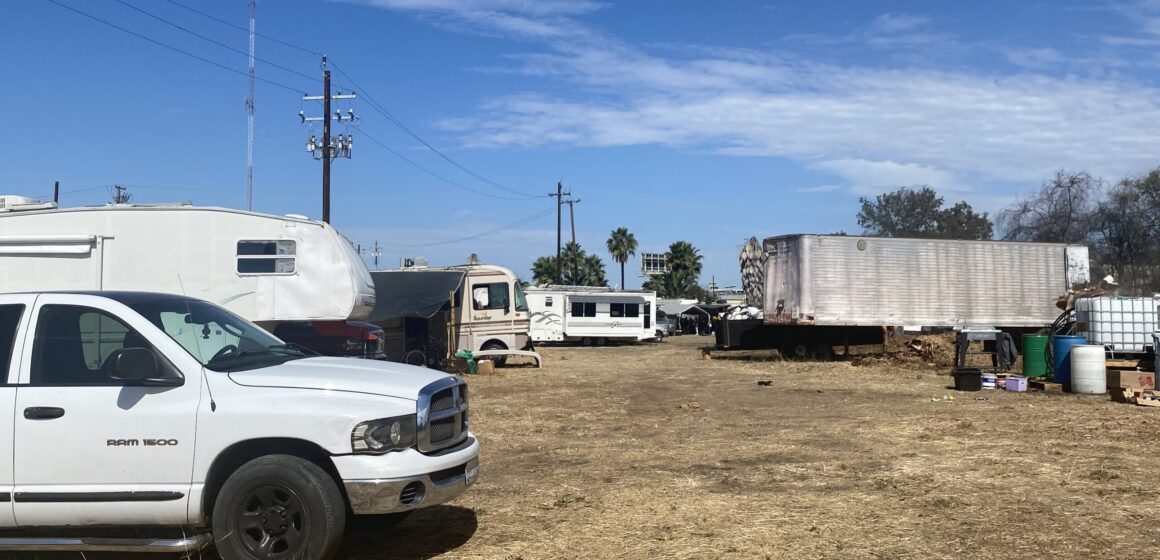 A truck and RVs parked on land in San Jose, California