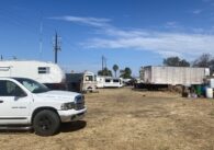 A truck and RVs parked on land in San Jose, California