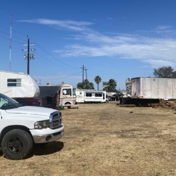 A truck and RVs parked on land in San Jose, California