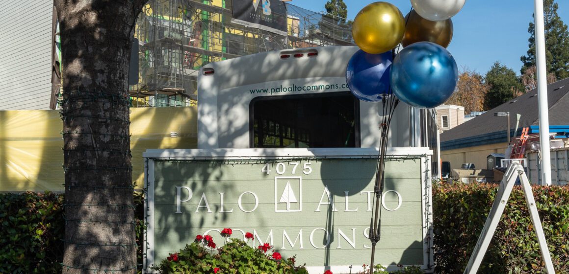 Balloons tied to a community sign in Palo Alto, California