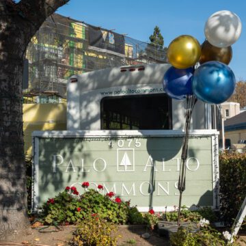 Palo Alto Commons Embarcadero Balloons tied to a community sign in Palo Alto, California