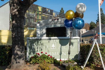 Balloons tied to a community sign in Palo Alto, California