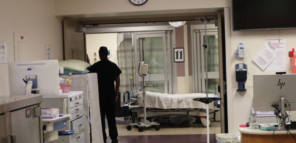 A person stands in the hallway of a hospital in San Jose, California