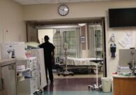 A person stands in the hallway of a hospital in San Jose, California