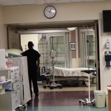 A person stands in the hallway of a hospital in San Jose, California