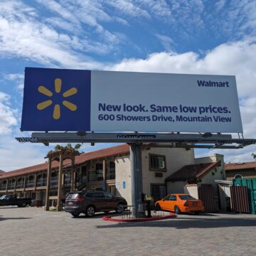 SANTA CLARA BILLBOARD A billboard in front of a hotel with a Walmart ad on it that reads, "New look. Same low prices. 600 Showers Drive, Mountain View."