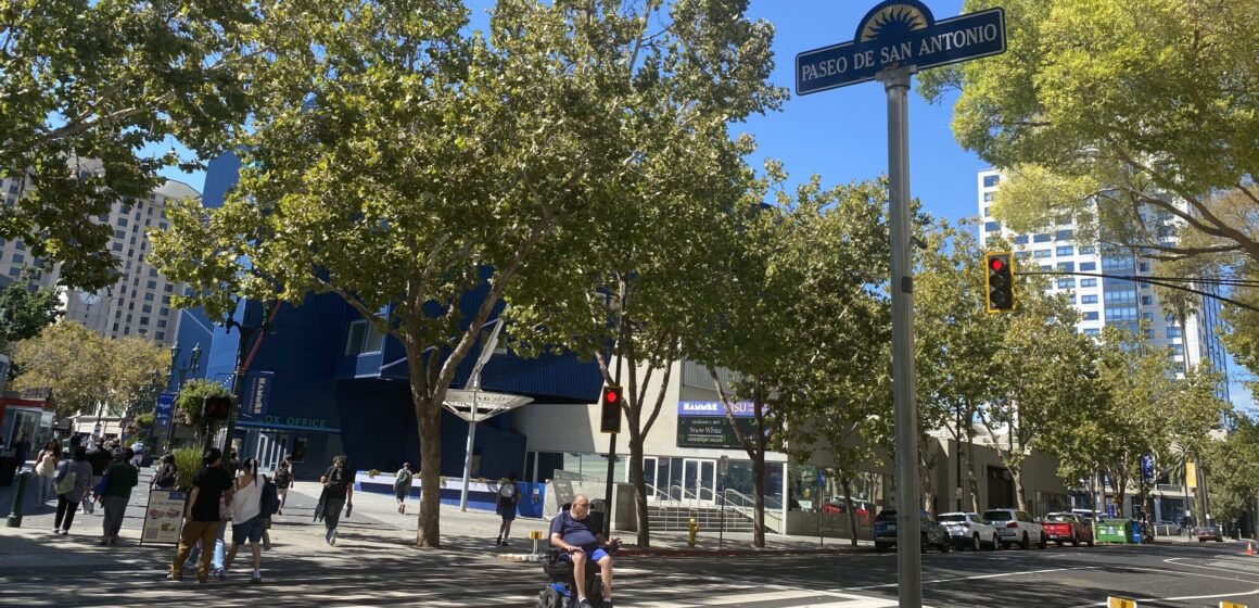 LARRY ITLIONG WAY People crossing a street in downtown San Jose, California