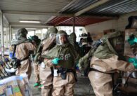 People in hazmat suits run a drill for a potential chemical attack in San Jose, California