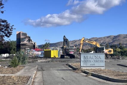 Excavators demolish a vacant former youth center in East San Jose, California