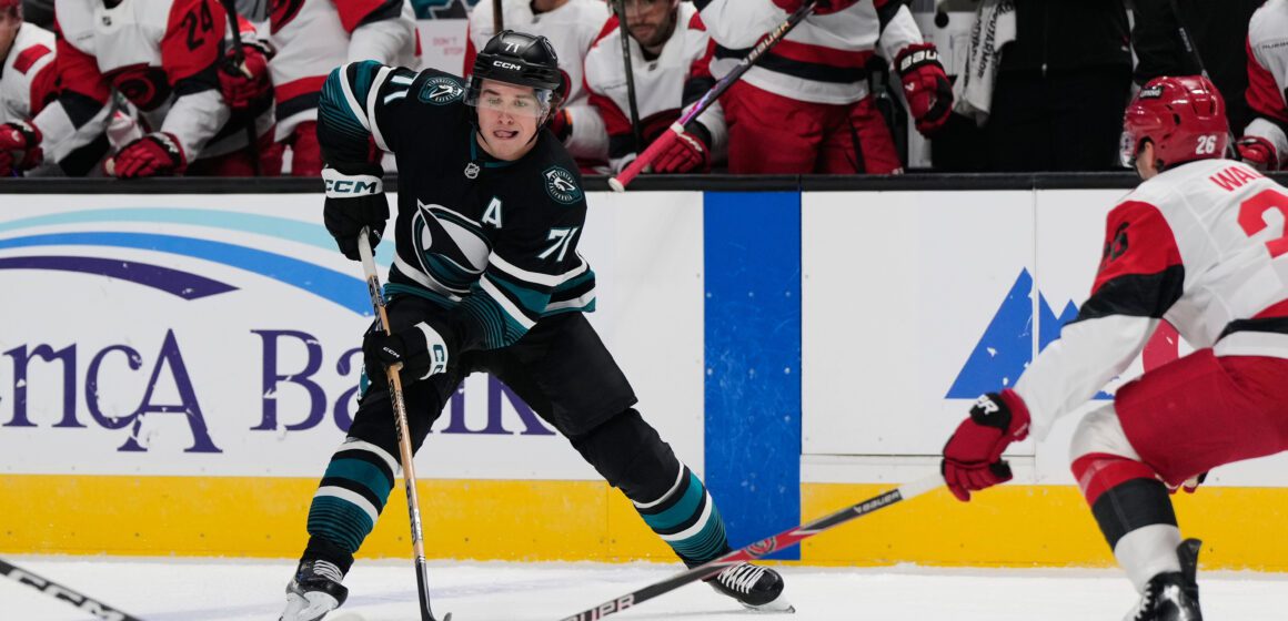 Hurricanes Sharks Hockey Two men playing professional hockey