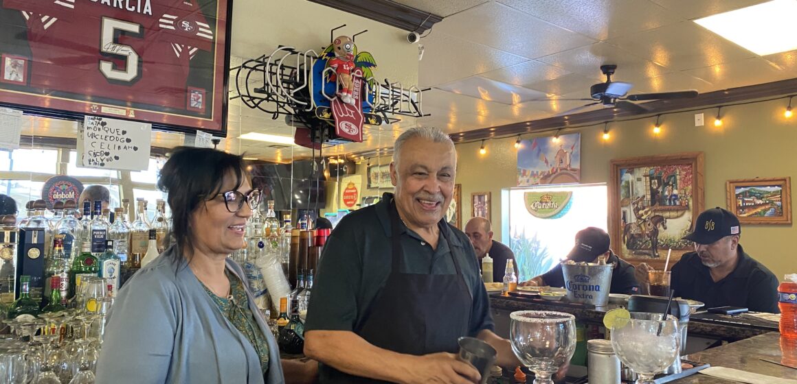 LOS GARCIAS RESTAURANT- BERNADETTE GARCIA- ALURA INN SAN JOSE A man and a woman stand behind the counter at a restaurant in San Jose, California