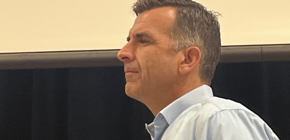 Side view of a man in a blue dress shirt