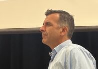 Side view of a man in a blue dress shirt