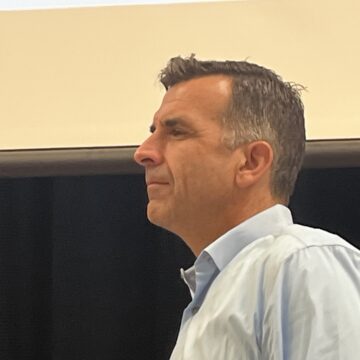 Side view of a man in a blue dress shirt