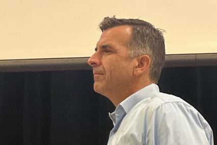 Side view of a man in a blue dress shirt