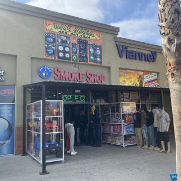 Bay Area Smoke Shop A retail storefront where the entrance is lined with toys and clothing displays.